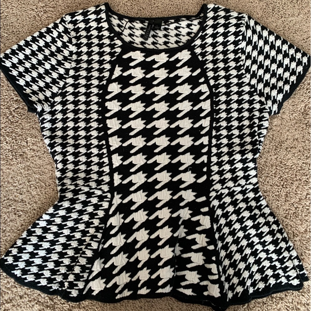 Short sleeve swears with a peplum hem.